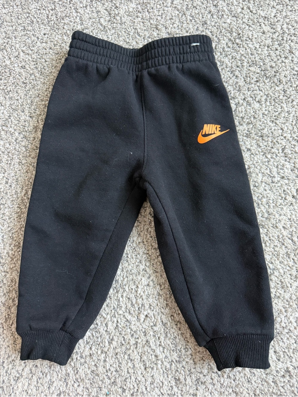 Nike Black Kids Sweatpants with Orange Swoosh